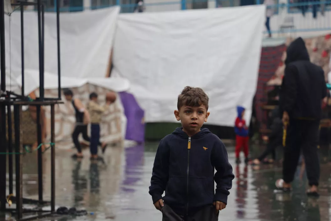Osama, a 6-year-old child, resides with his family in a tent at a shelter in the city of Khan Younis, enduring the increasing presence of cold and rain.