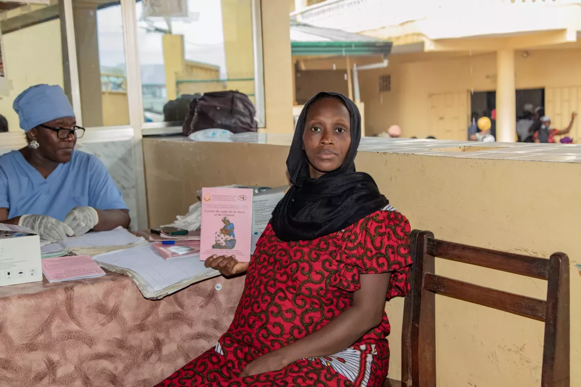 Assiatou, 27, mother, pregnant, having just been vaccinated, Conakry, Guinea. Bernay-Fotoba health centre in the Matoto commune of Conakry, Guinea.