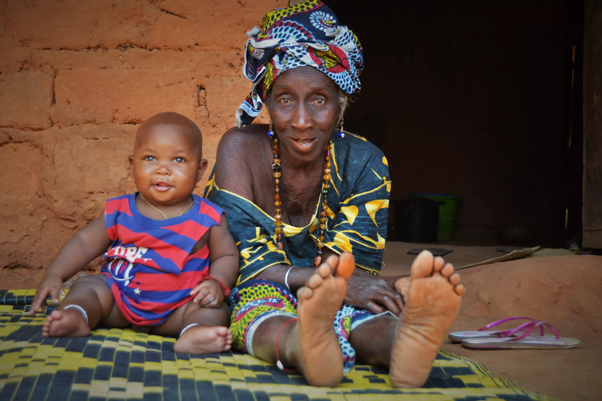 Woman sitting along side a child