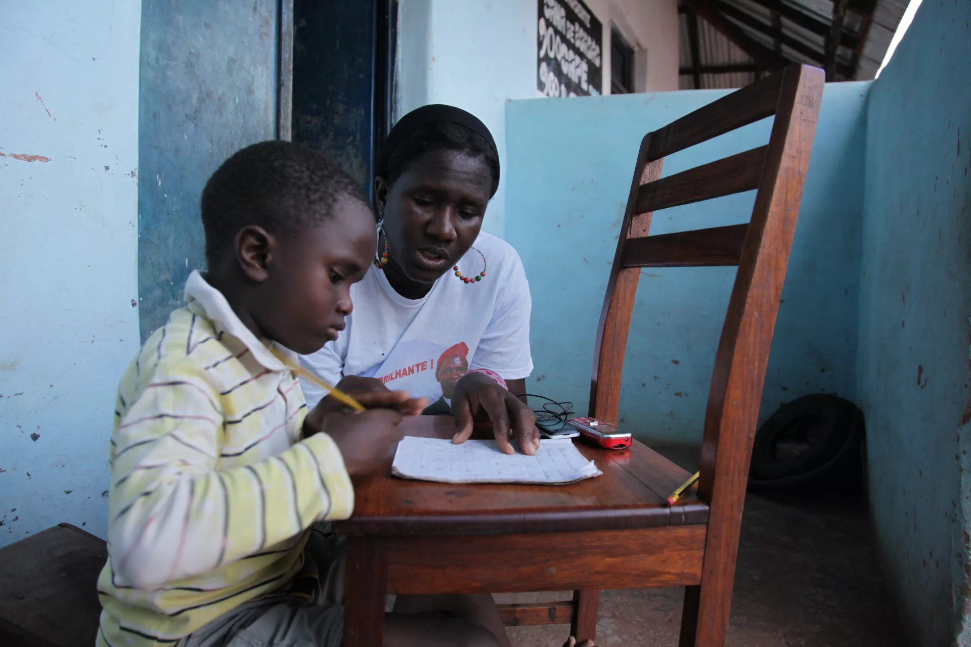 Child studying at home with mom