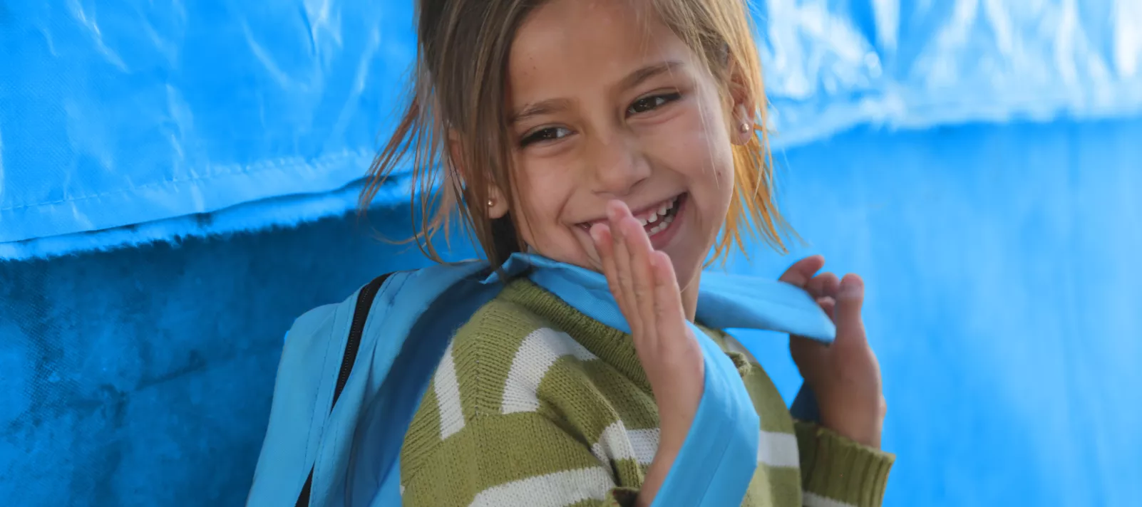 A girl by her family tent
