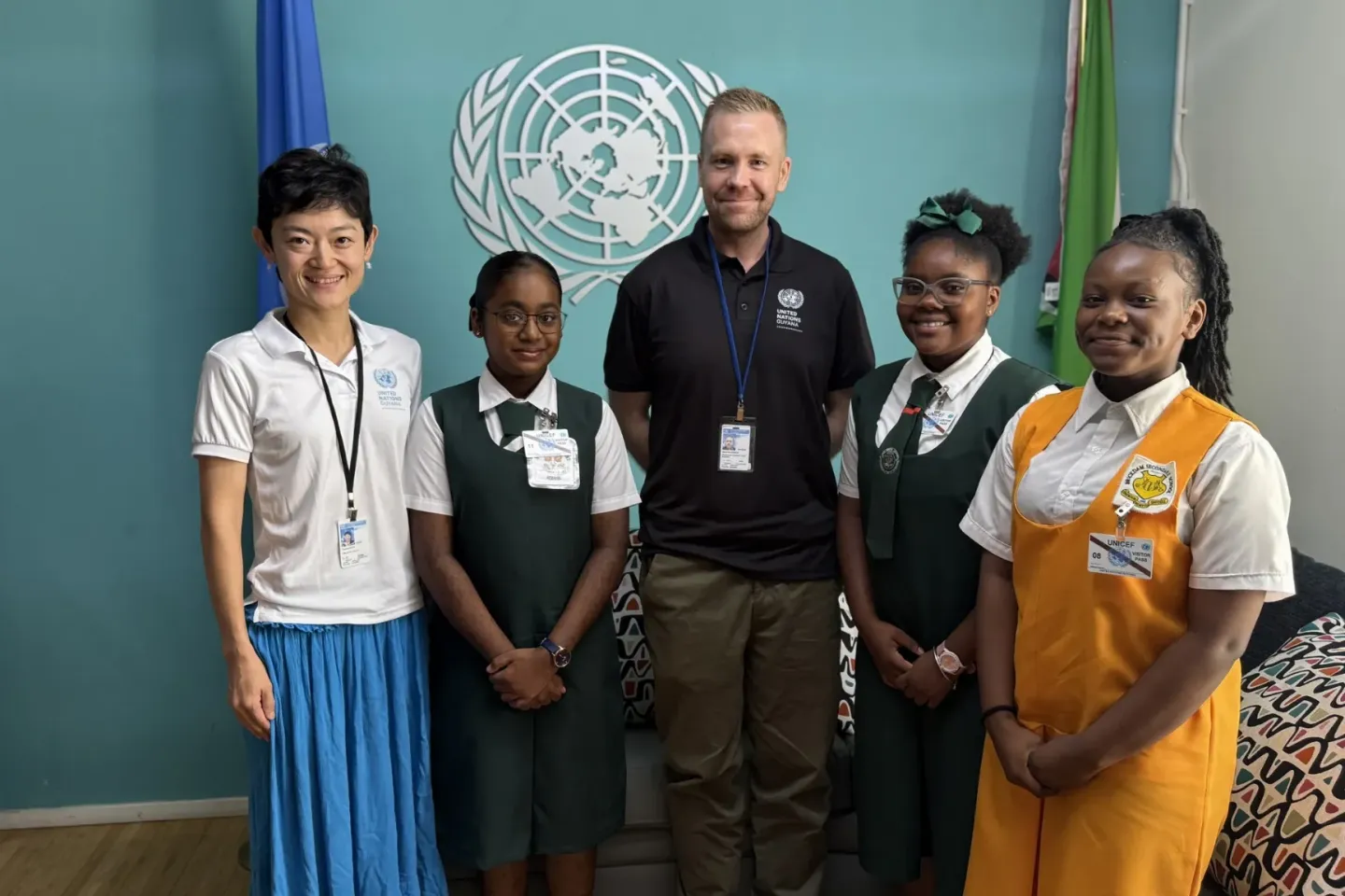 Jada Felix, Khristha Itwaru, and Blessings Roberts with officials from The UN Resident Coordinator's Office
