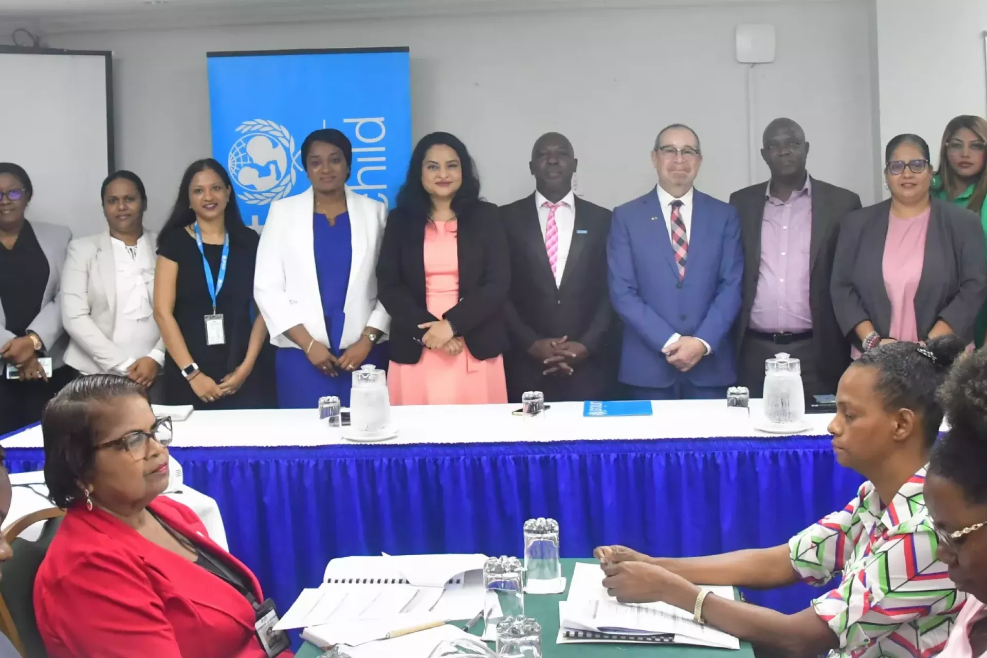 Minster of Human Services and Social Security Dr. Vindhya Persaud, UNICEF Social Policy Specialist Michael Gillis and High Commissioner of Canada His Excellency Mark Berman with ECD Policy Development team