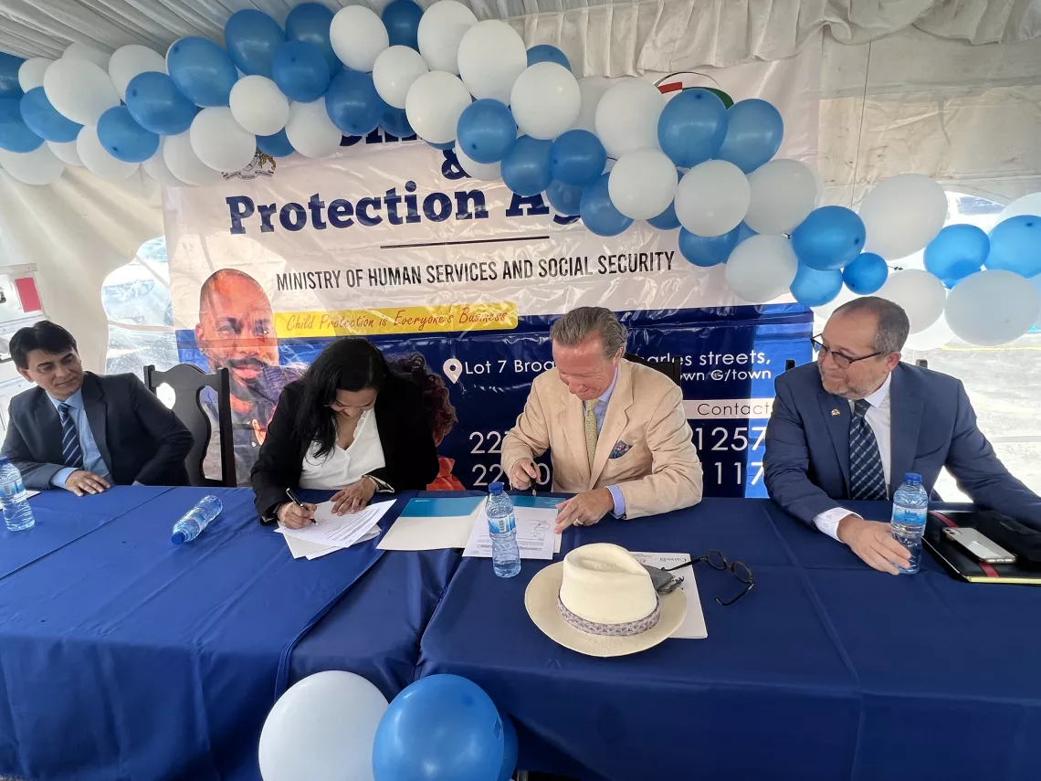 Minister of Ministry of Human Services and Social Security, Hon. Dr. Vindhya Persaud and Country Representative of UNICEF Guyana, Nicolas Pron signs handover agreements of ECD kits.
