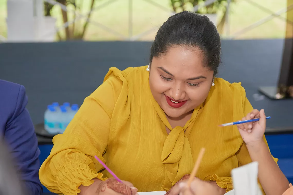 First Lady of The Co-operative Republic of Guyana Mrs. Arya Ali participating in the Art for Mental Health activity in celebration of World Children's Day 2022 at State House