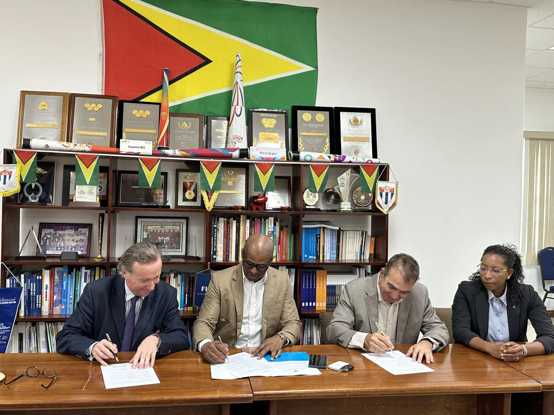 UNICEF Representative Nicolas Pron, GOA President Godfrey Munroe and Charg&eacute; d&rsquo;Affaires & Head of the French Diplomatic Bureau Jean-Jacques Fort&eacute; sign partnership agreement