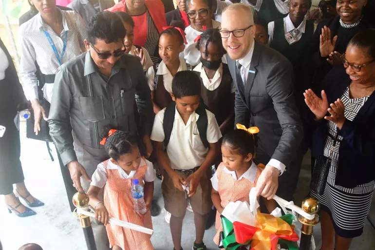 Attorney General and Minister of Legal Affairs Mr. Anil Nandlall SC, UNICEF Representative ai Gabriel Vockel, Chief Justice Madame Roxanne George with children from the Charity Primary School at the opening of the Charity Children's Court