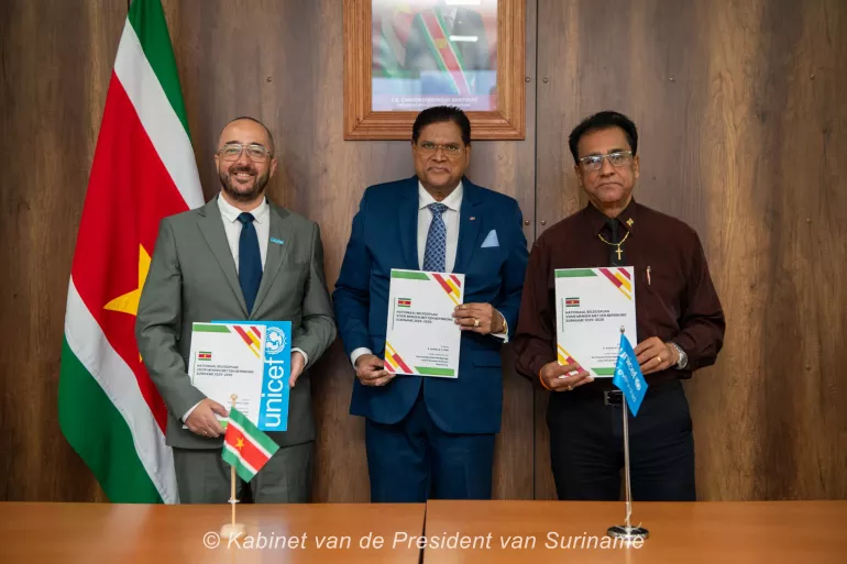 UNICEF Program Manager Suriname, President of Suriname and Chair of the disability commission hand-over national disability policy