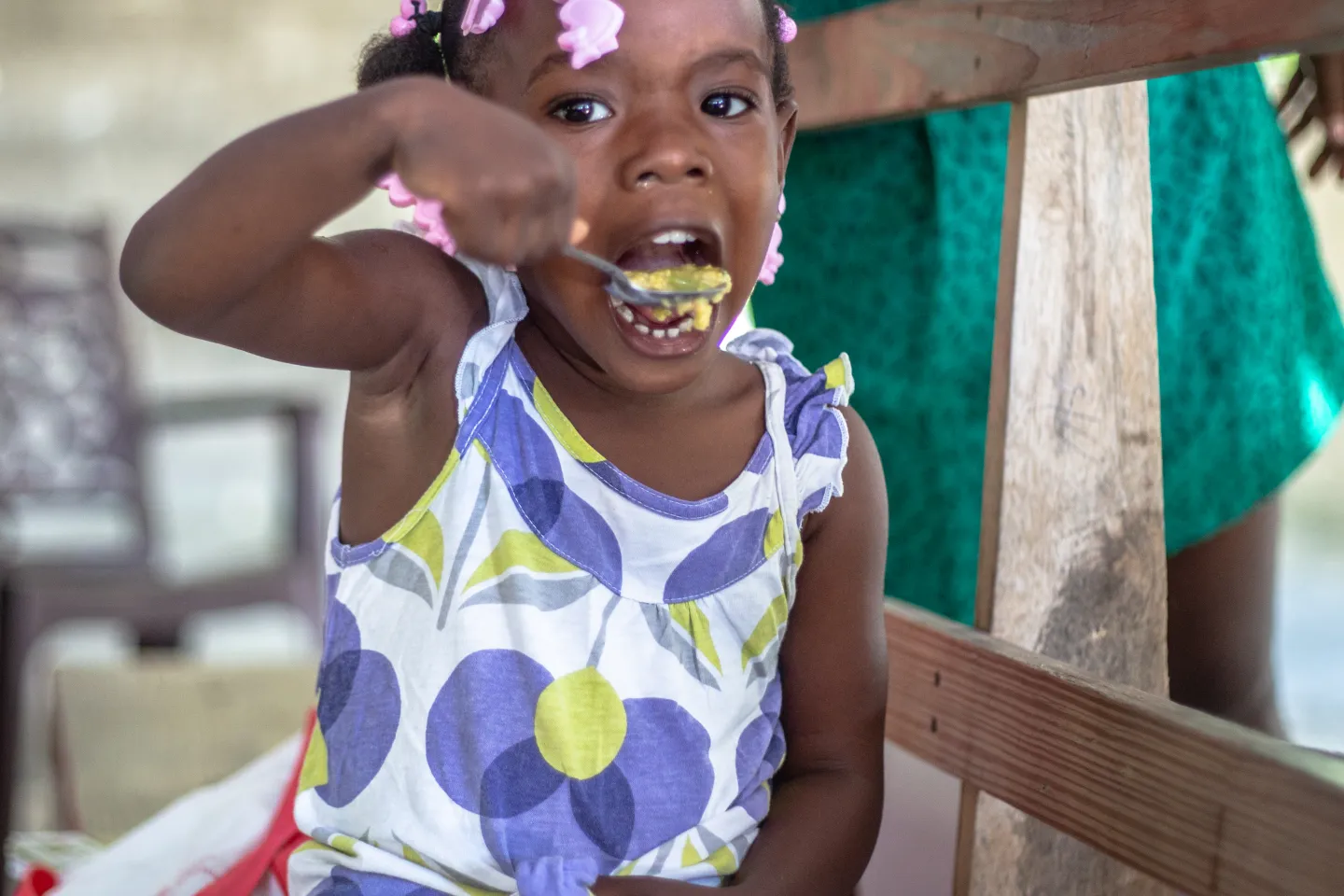 A child eating at the Chardonni&egrave;res Mothers' Club