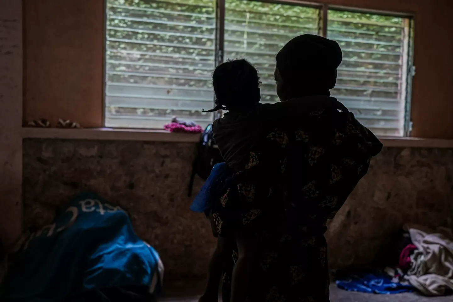 A woman with her child at a displaced site in Port-au-Prince