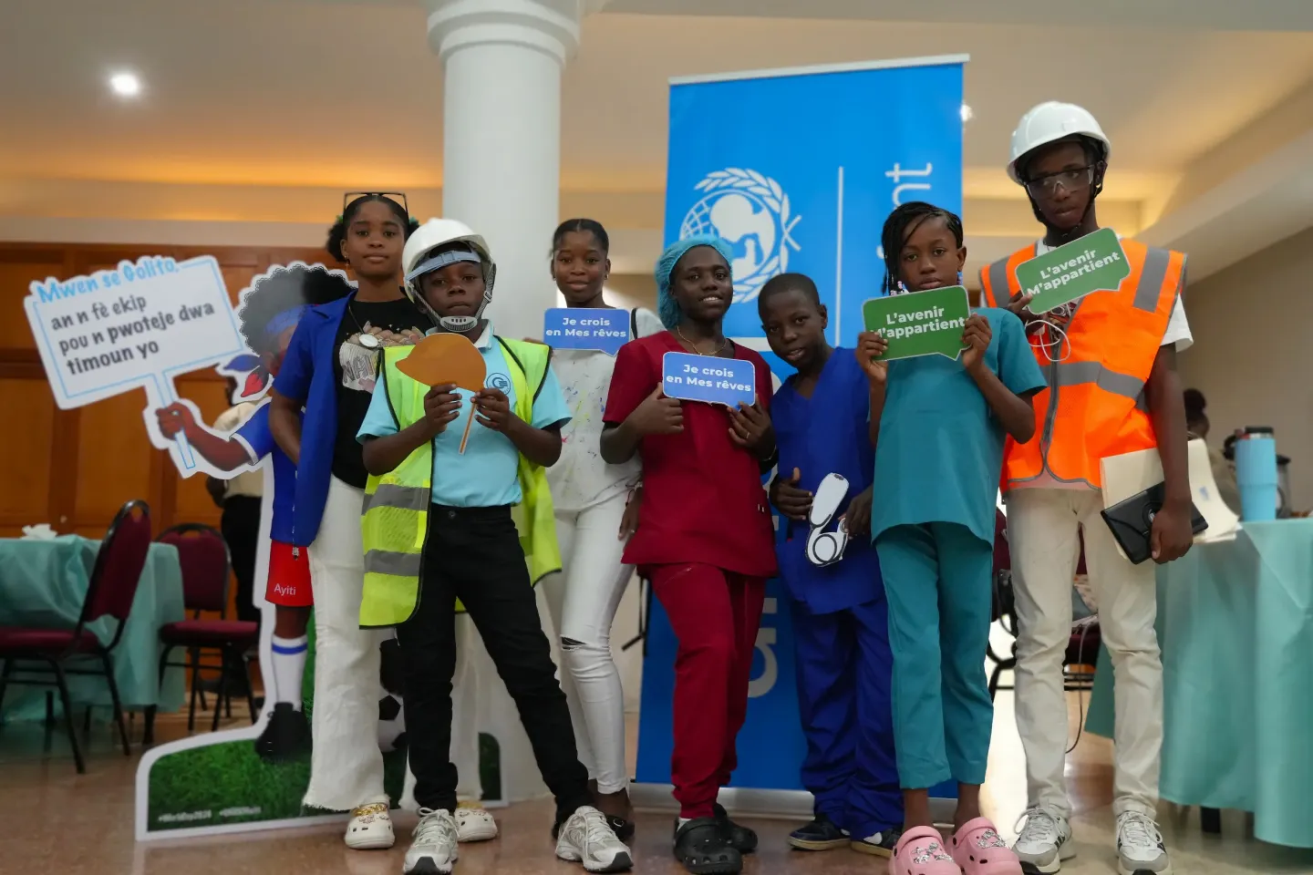 A group of children stand for a group picture