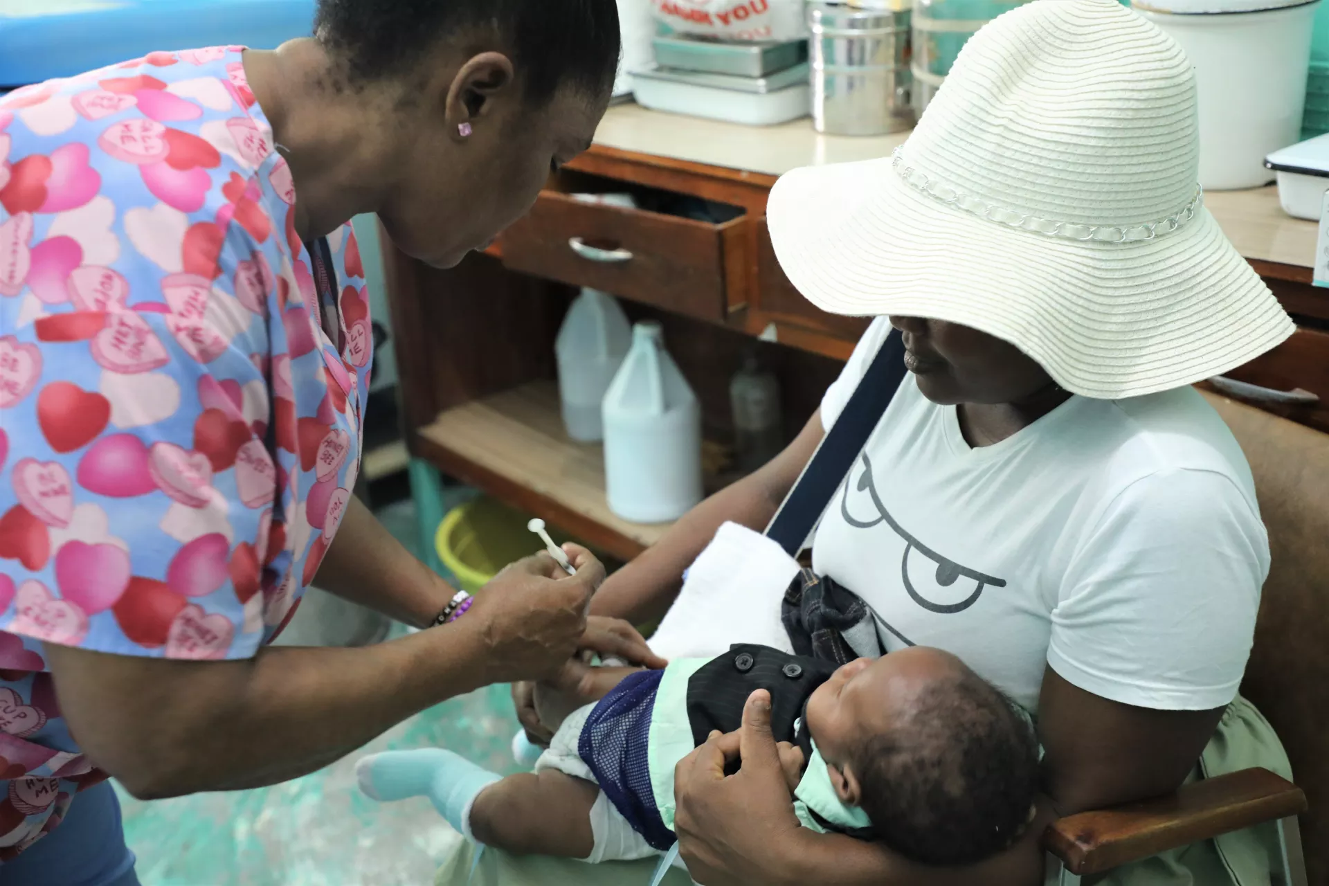 A nurse vaccinates a child.