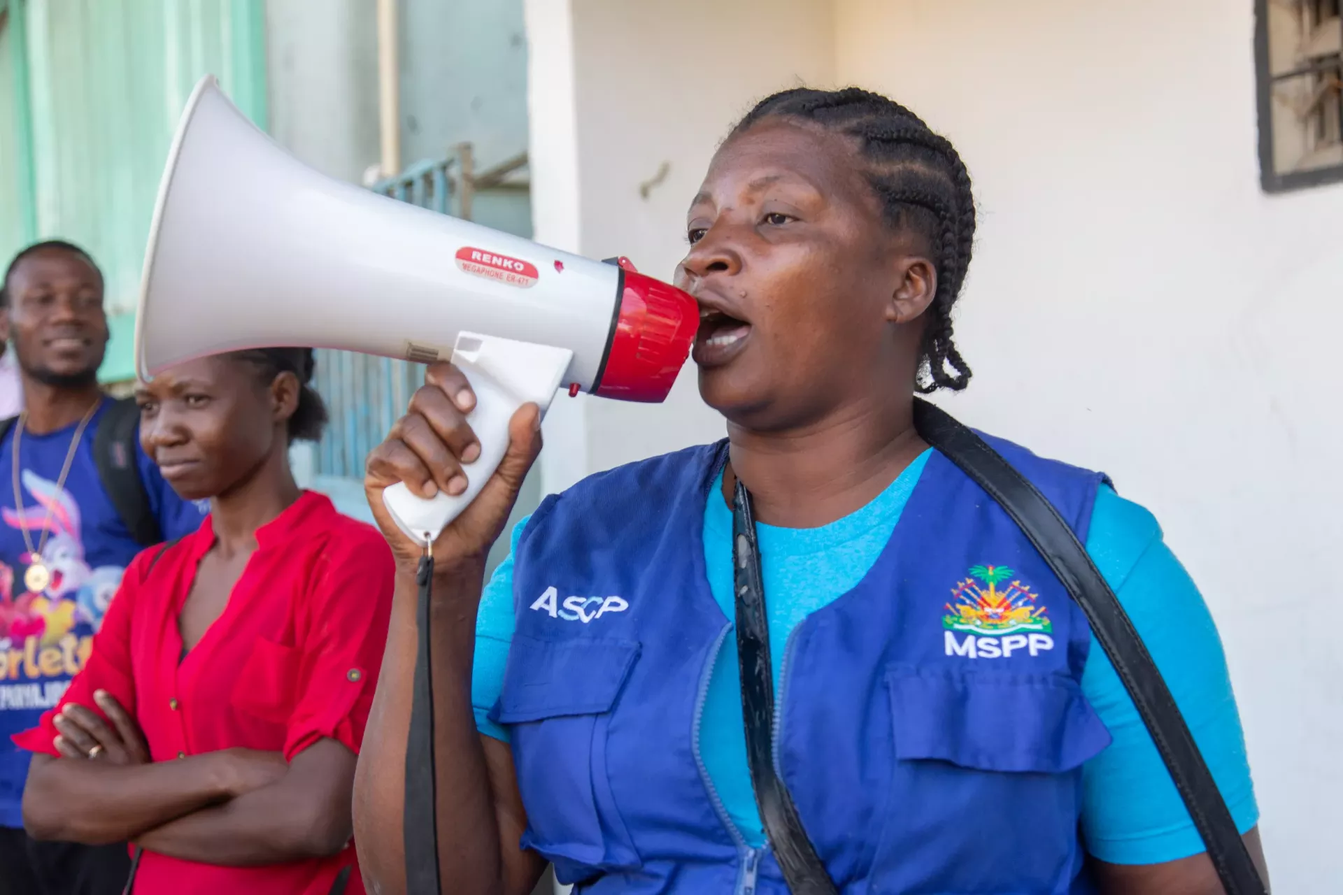 Pearl uses her megaphone to raise awareness of cholera in her community.