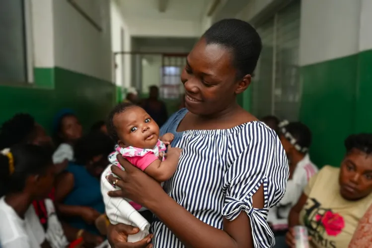 Cefaneffe takes her daughter Anne to get vaccinated.