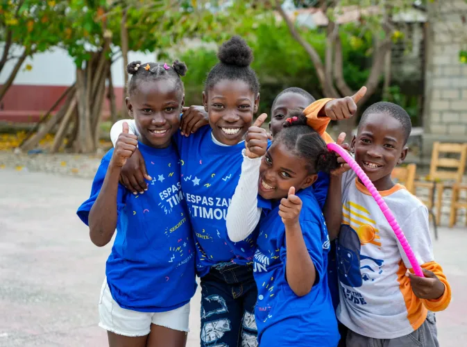 A group of children smiling