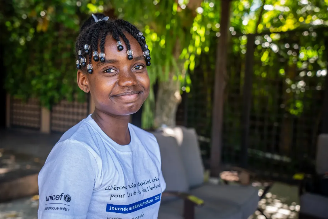 A young girl smiling