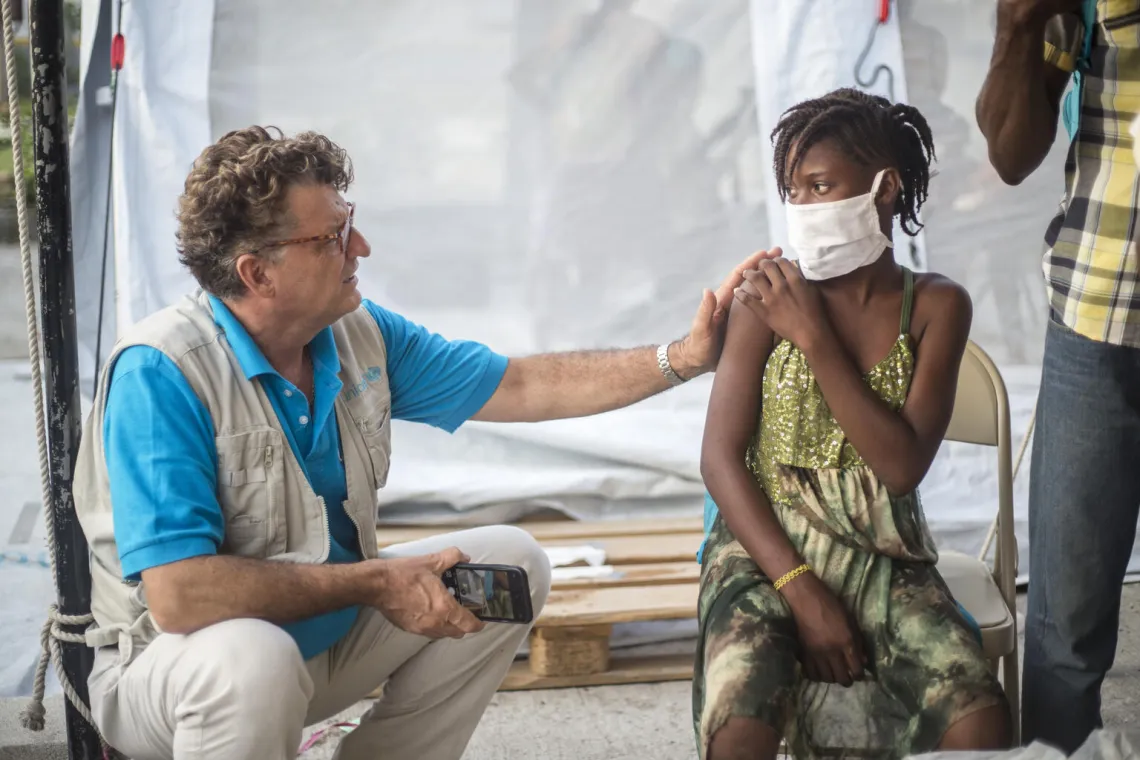  Bruno Maes, UNICEF representative speaking with young Maliya.