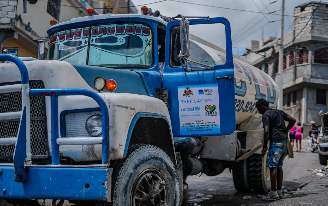 As soon as the water tanker arrives, the whole neighbourhood springs into action.