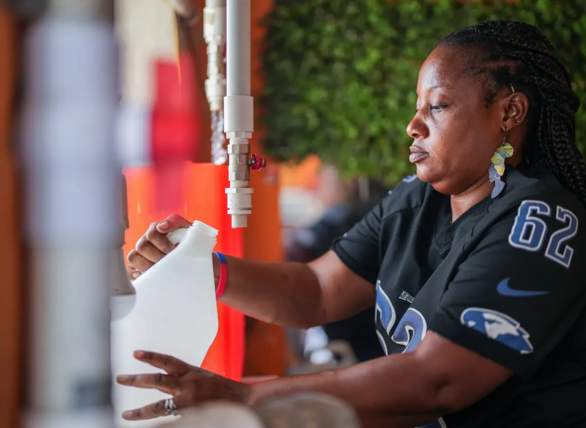 Mackendise, manager of a water kiosk in Delmas.