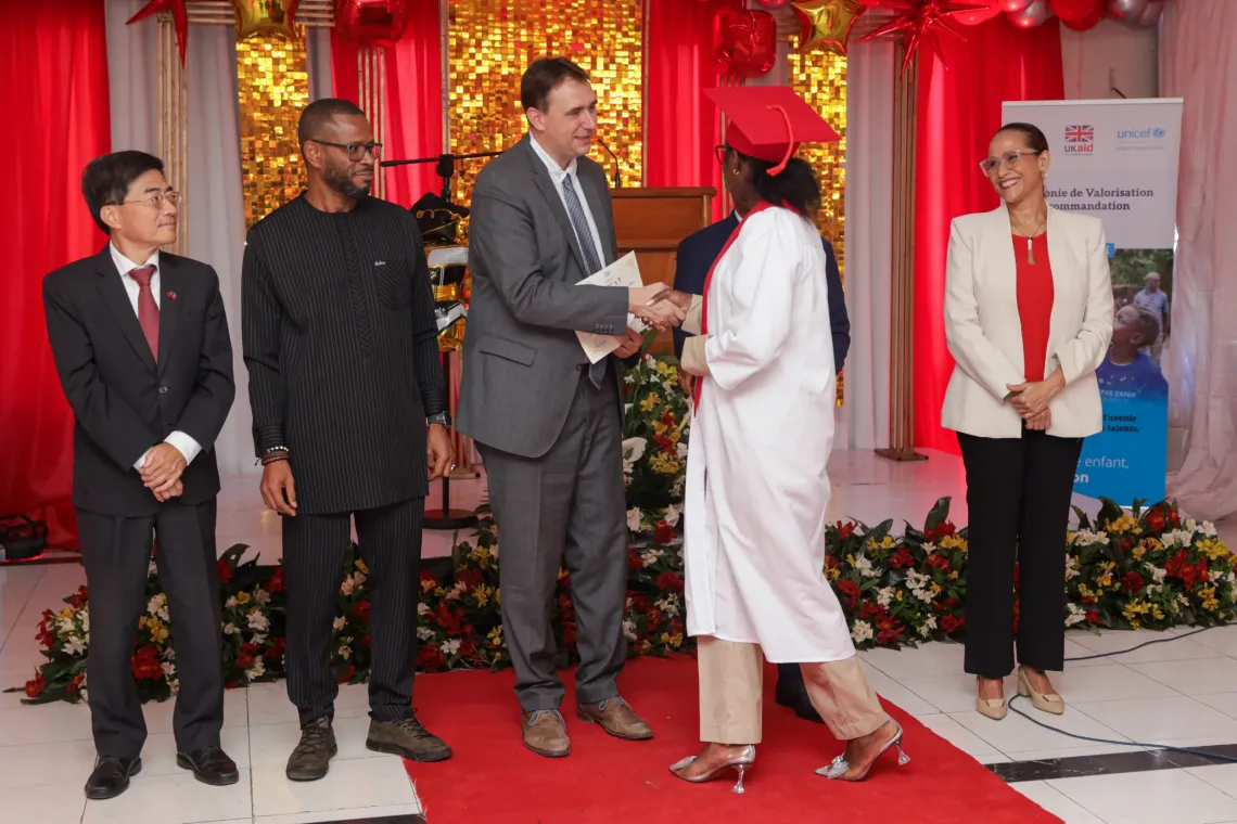 A group of people distributing certificates