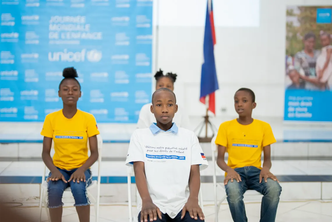 Four children participating in a theatre