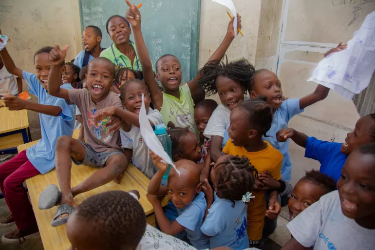 The smiles of displaced children participating in catch-up classes at displacement sites reflect their joy and hope.