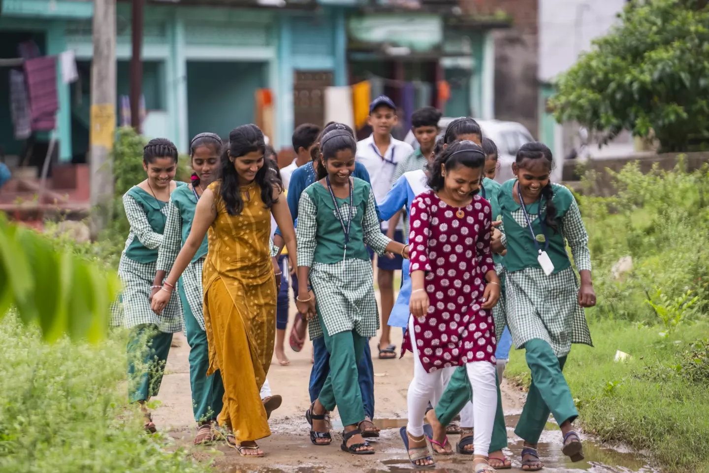 The Advika group make their way through their village to the Anganwadi Centre