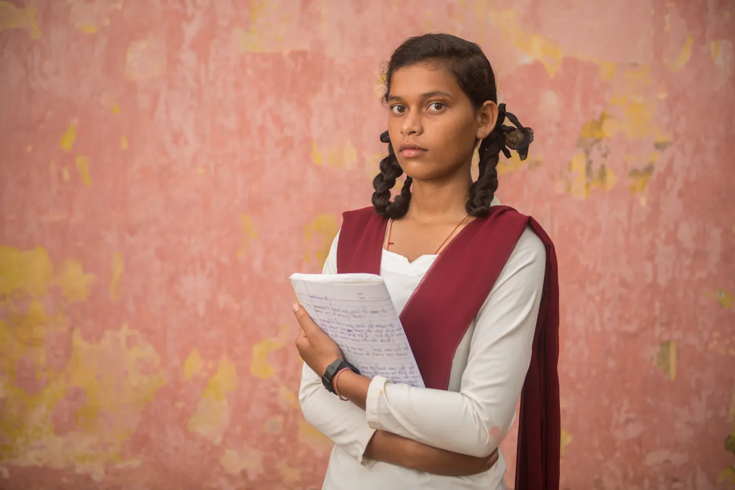 Kusma Kumari poses outside her classroom in the Pirra government school in Kanke block of Ranchi in the central Indian state of Jharkhand.