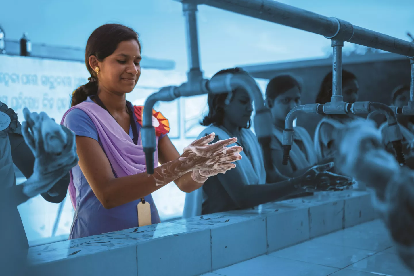 Champa Bag, Prime Minister of the Child Cabinet, enjoys a fun hand wash demonstration session at their dedicated hand washing station at the Pujariguda UGHS school in Rayagada district.
