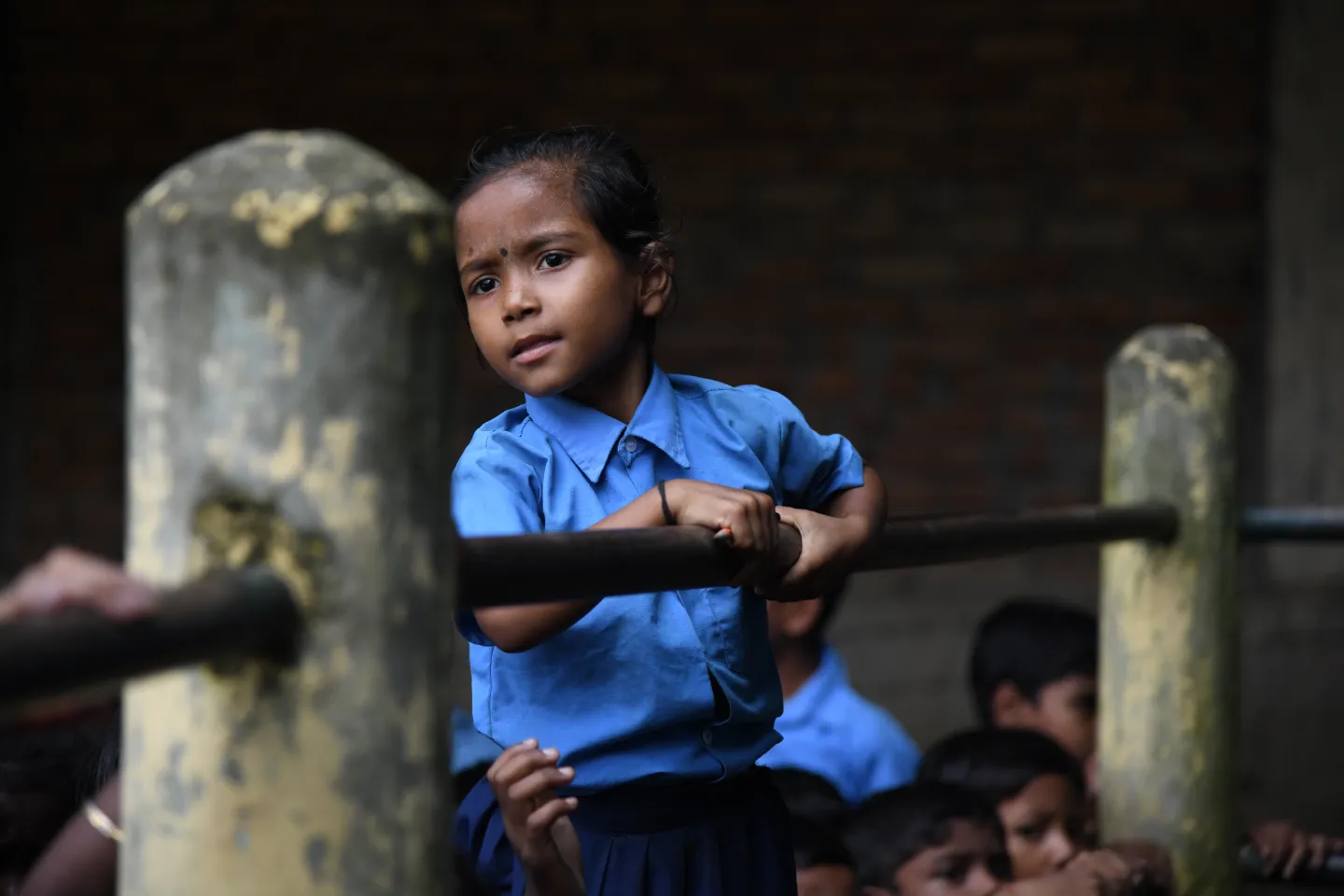 A child standing in school.