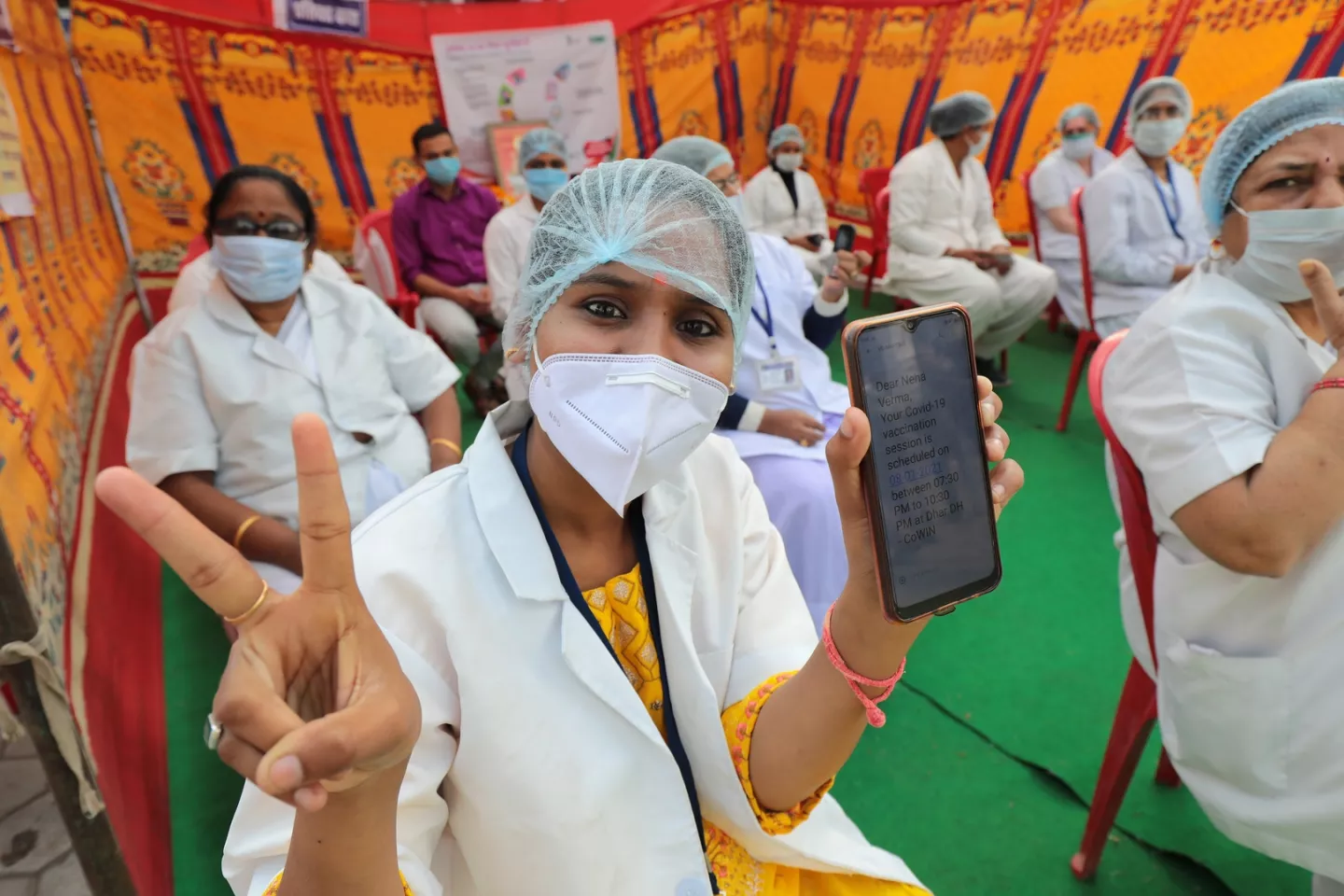 Dry run for COVID19 vaccine being held in Dhar, Madhya Pradesh, showing health care workers receive SMS for vaccination, waiting at the center and following other protocols during the nation wide dry run.