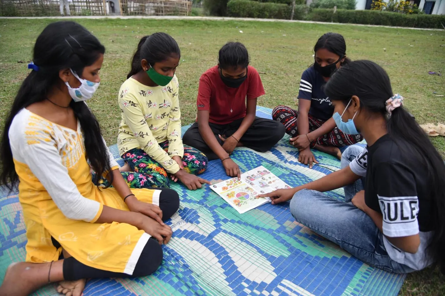 Prity Tanti, 18 yrs, member of the adolescent girls club speak about the nutrition food to her club members at Anandabari Tea estate in Dibrughar district of Assam.