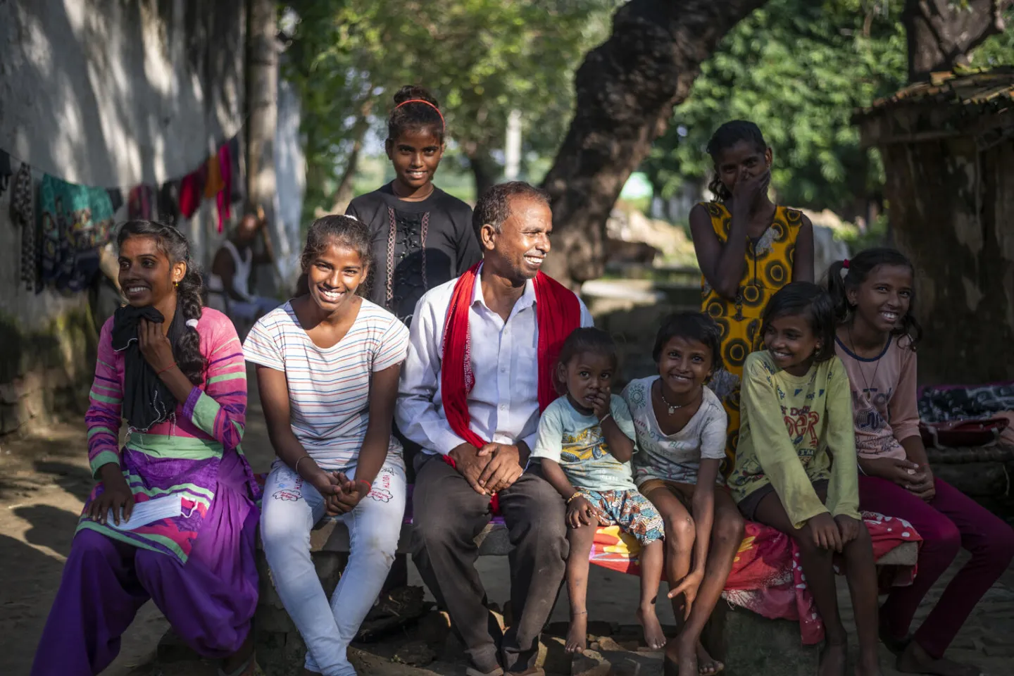 Basant Lal reacts as he sits with his family at his house in Bhagesar in Mirzapur, Uttar Pradesh.