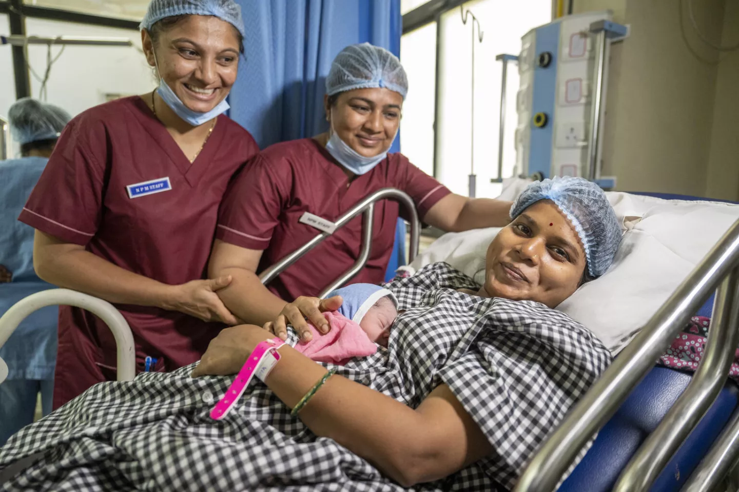 Hamida Sakim with her new born baby boy at the midwidery led unit .Location : PDU Civil Hospital, Rajkot, India,