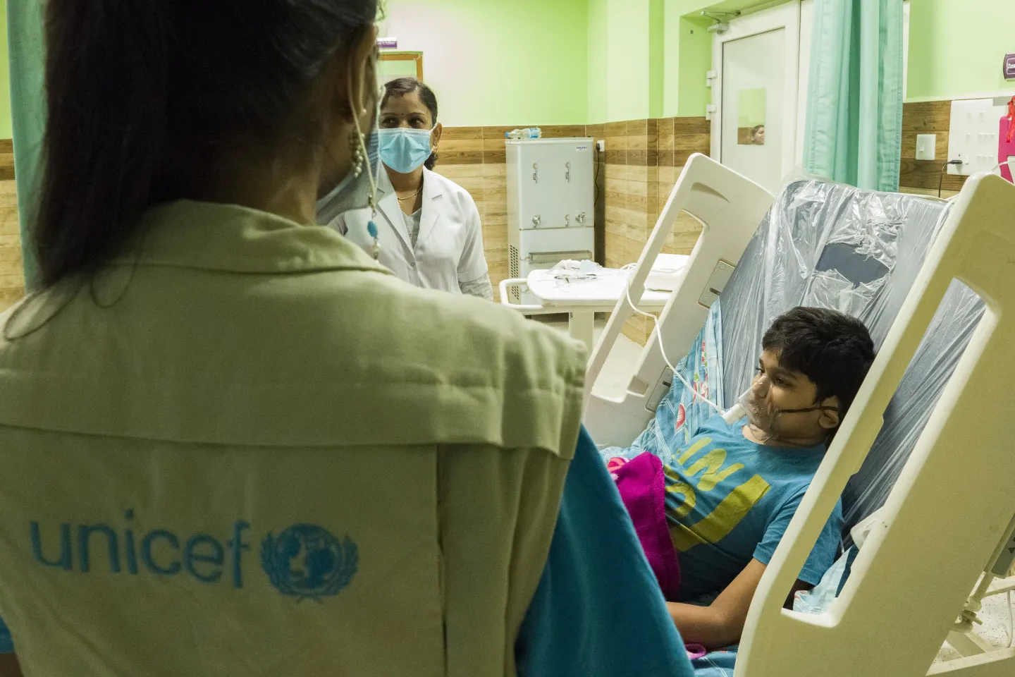Satyam Kumar (R), Son of Rina Kumari, who had been administered Oxygen for 4 to 5 houses after suffering from asphyxiation using the OGP installed by UNICEF, displays wearing an Oxygen mask for demonstration purpose at the LNJP hospital in Patna, Bihar