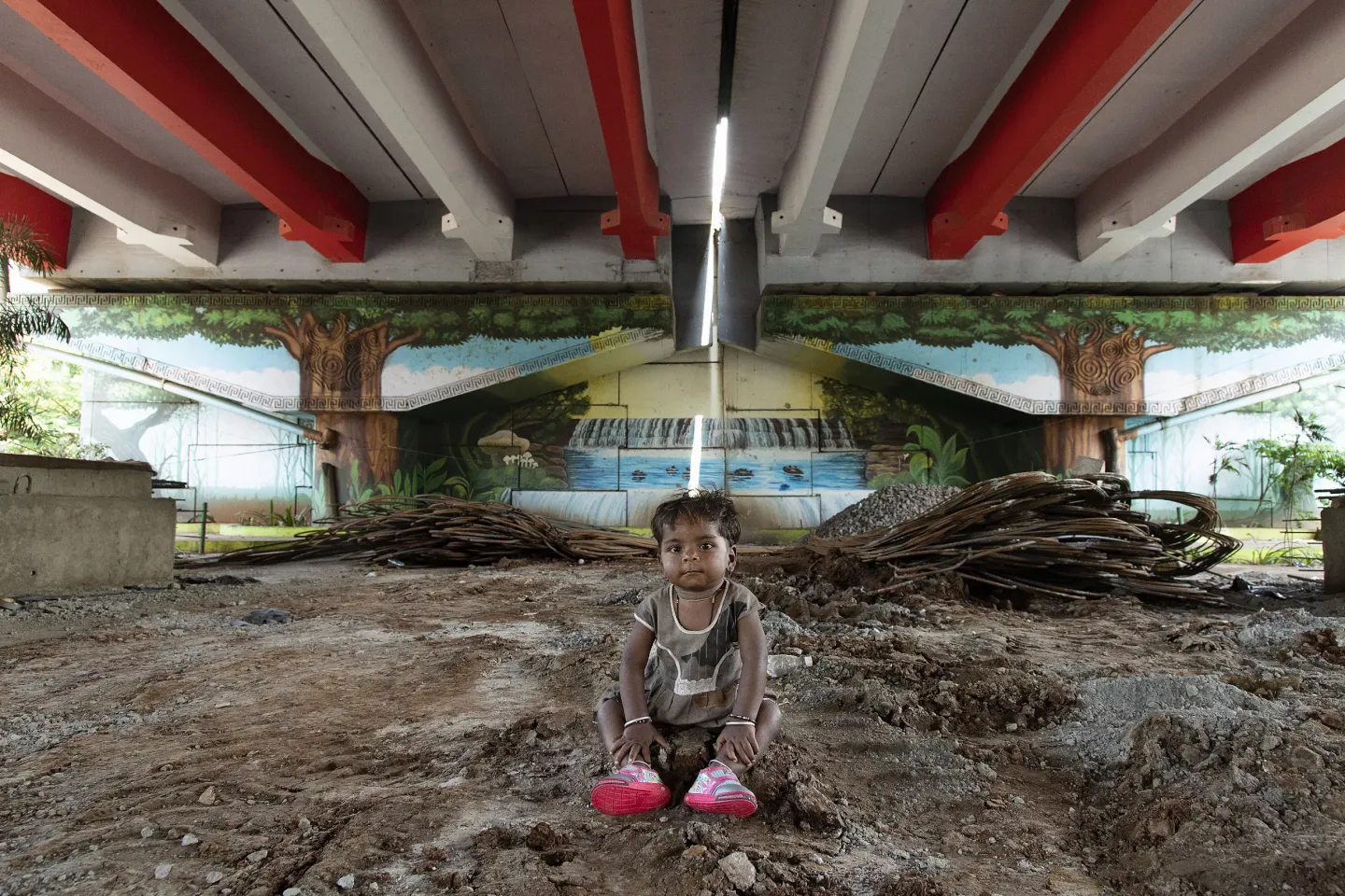 Shyam Vishal Kale, 2, sits under the flyover at Kherwadi, Bandra (E), Mumbai, India, on 17 October 2022.