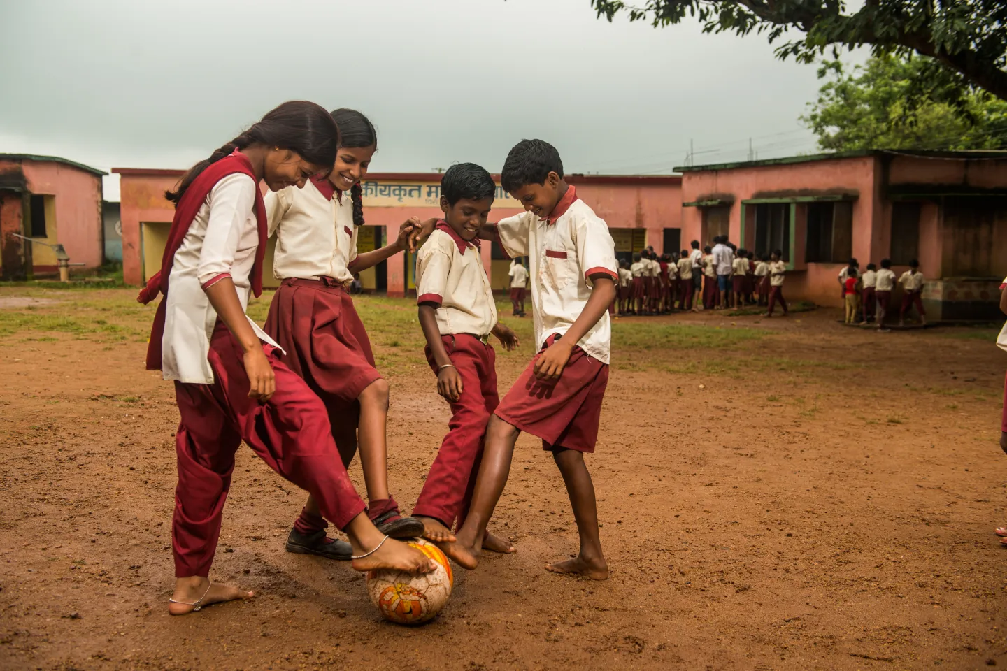 Girls and boys play football during a break in the Government Model School Pirra in Kanke block, Ranchi, Jharkhand.
