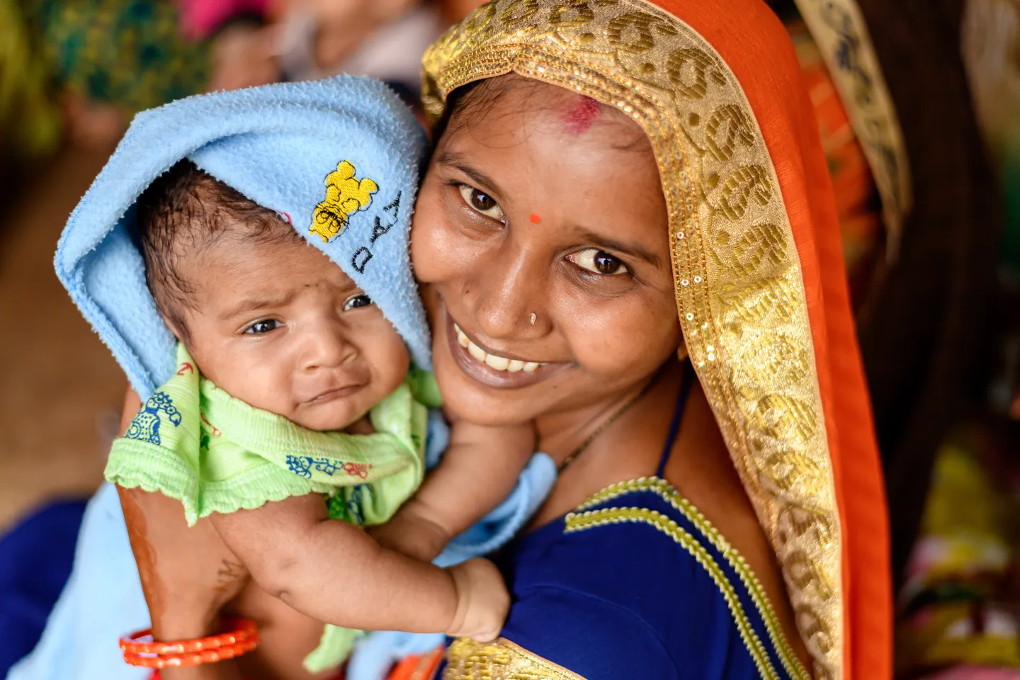 Mother holding her baby.
