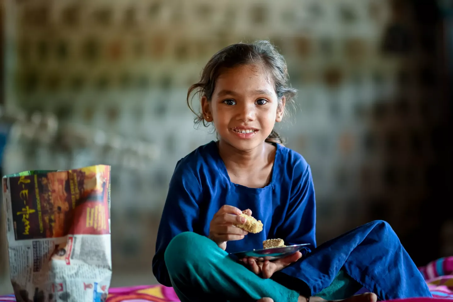 Minaxi Patel ( 5 years) is given 1 kg sukhadi prepared at AW.