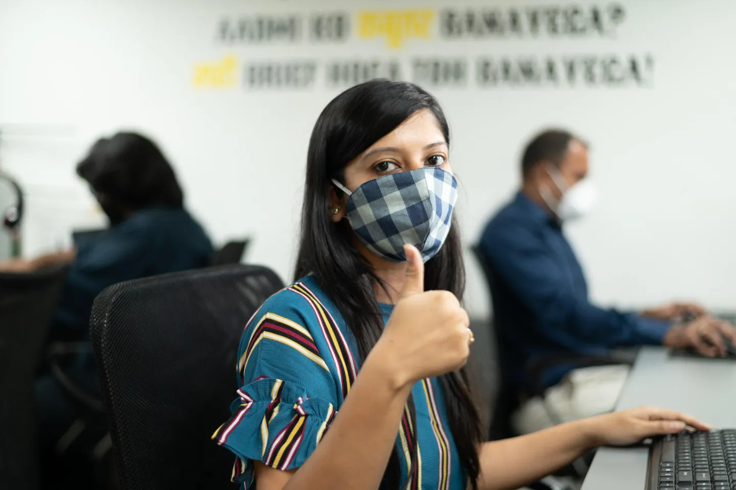 Ruchi Bhatt wears a mask while at work.