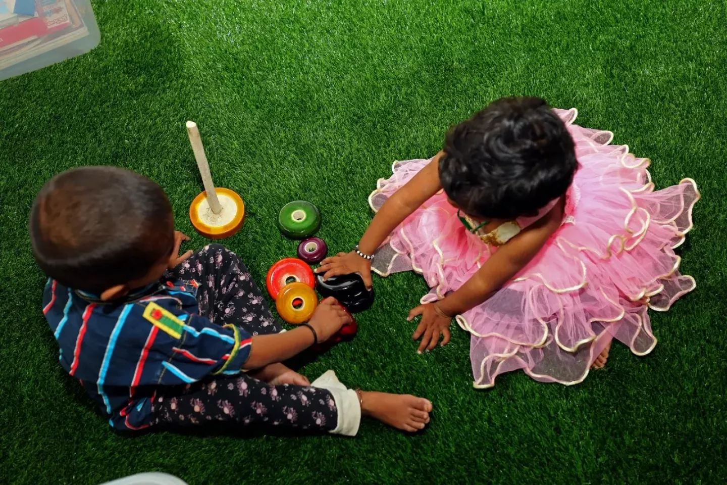 Children play with toys to stay active and stimulate their senses at the Nutrition Rehabilitation Centre, Chikkabalapur, Karnataka.