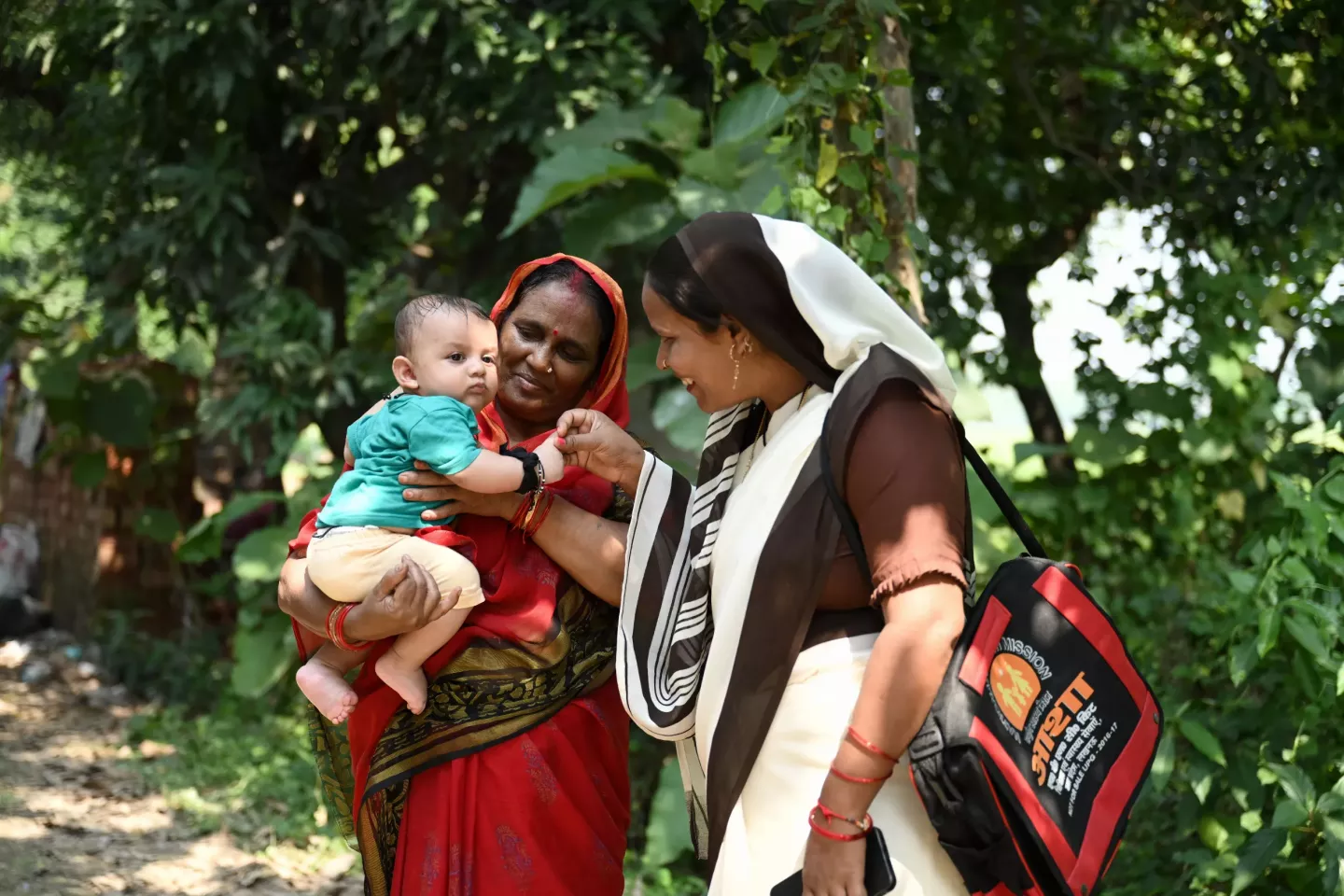 A touching moment in Gorakhpur, Uttar Pradesh, as Mamta Yadav (Asha Didi) receives recognition from grandmother Gyanti Devi while holding her 5-month-old grandson, Shivang.