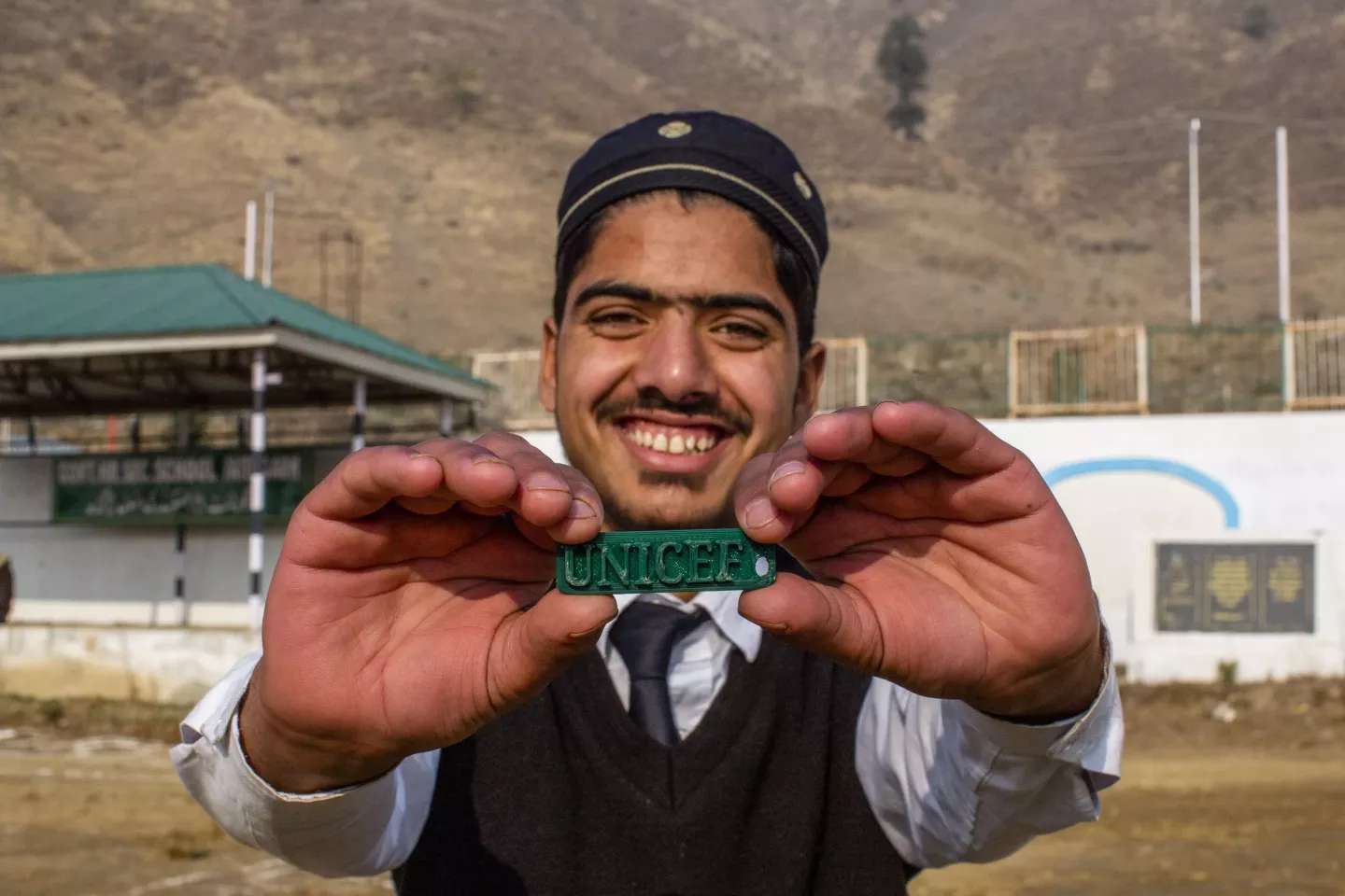 Toufeeq Ahmad Fafoo poses with a keychain he crafted in his labat the Atal Tinkering Lab At Government Higher Secondary School, Fatehgarh, in the District of &nbsp;Baramulla in Kashmir, India- 15 December 2024.