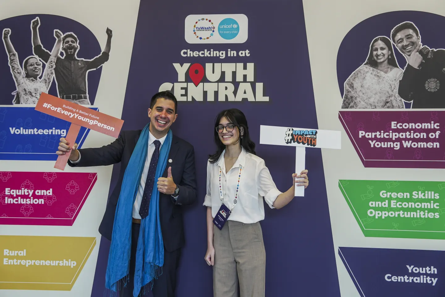 Portrait of United Nations Assistant Secretary-General for Youth Affairs, Dr. Felipe Paullier smiling with a member of the YuWaah Young People's Action Team (YPAT)