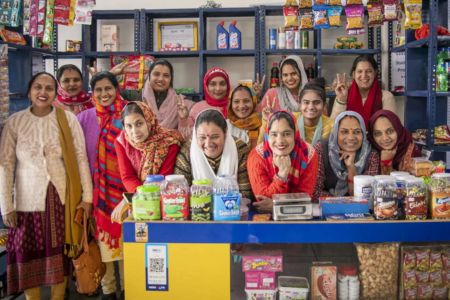 A bunch of rural women smiling 