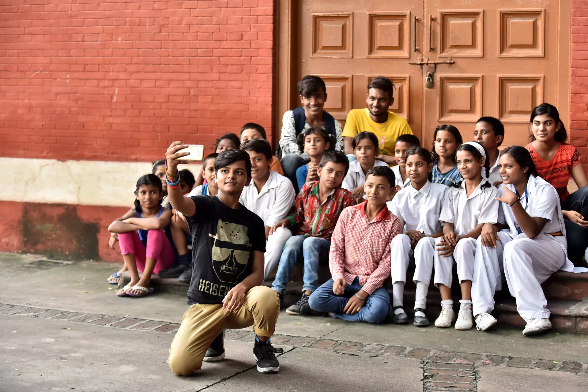A group of children taking selfie.