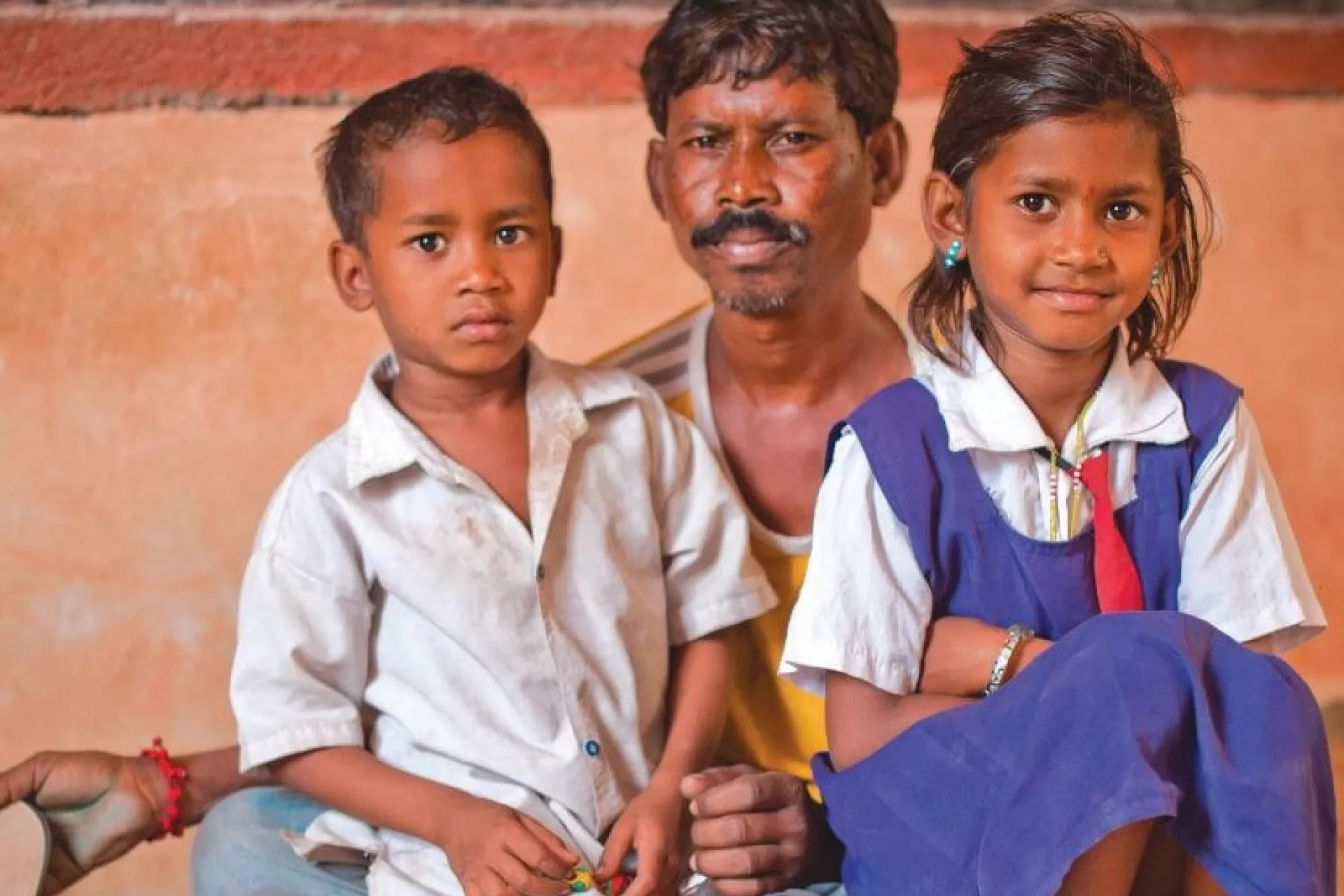 A father with his son and daughter.