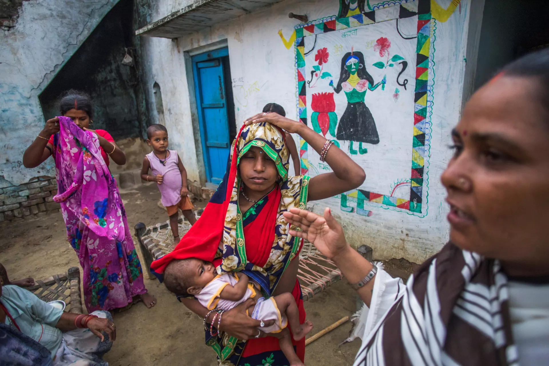 Mother taking a child to SNCU centre.