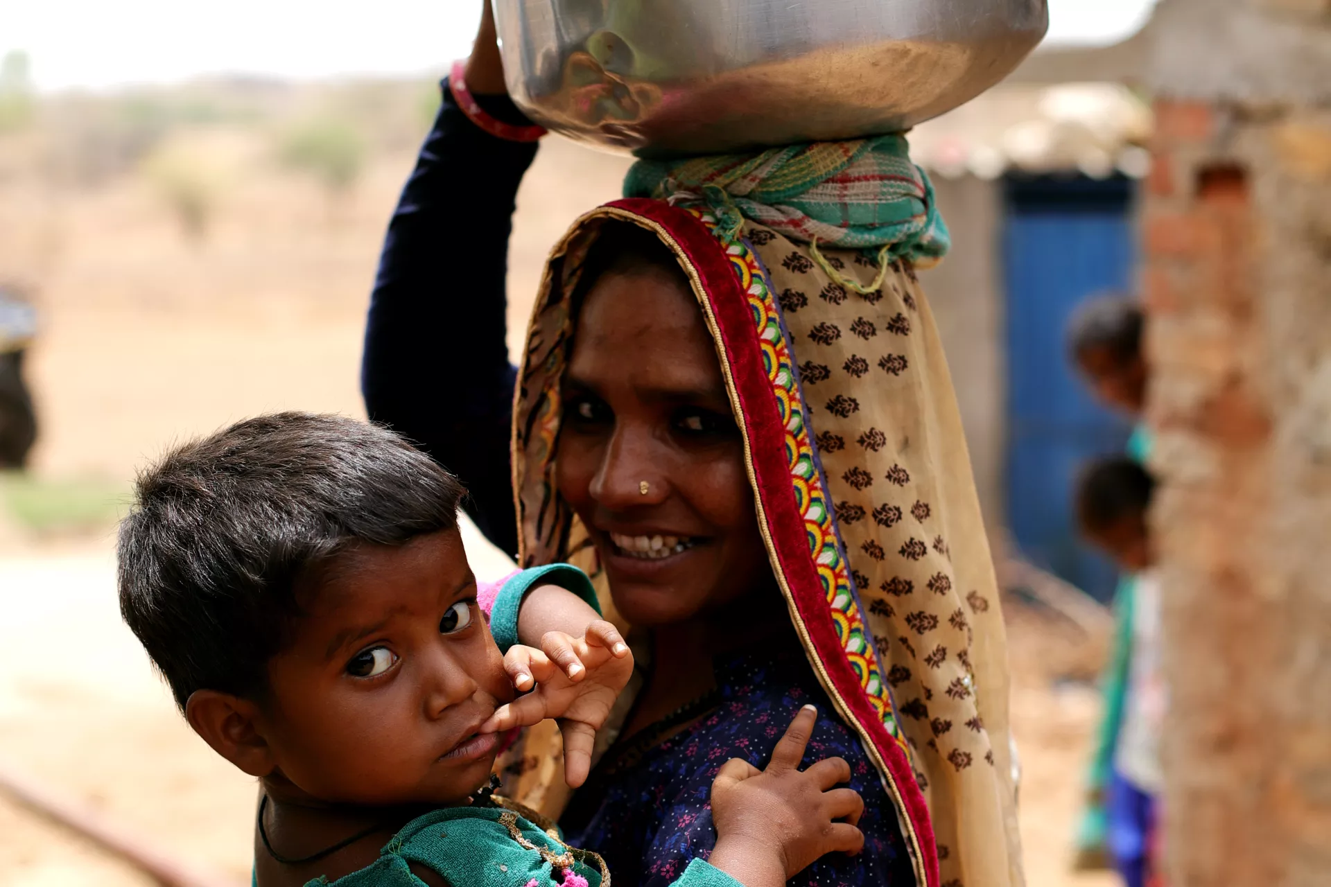 Kajal Ben, 2, with her Mother Lila Ben in Village Kukdi of Banaskantha District of Gujarat state, India. 