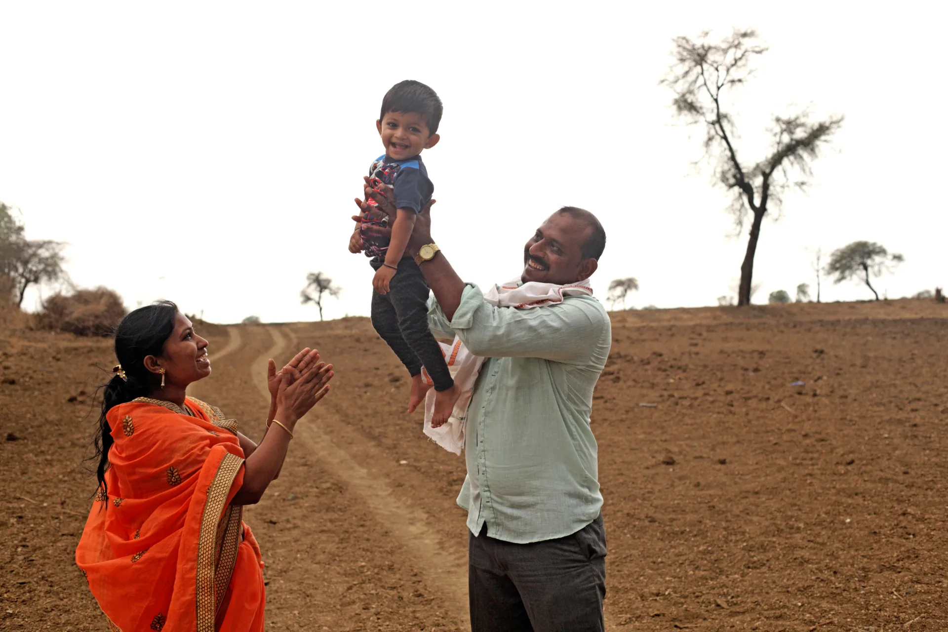 Sachin Chaudhary and his wife Swarna Chaudhary playing with their 2 &ndash; year old son Krishna Chaudhary.
